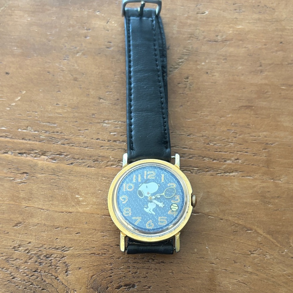 Snoopy watch - cute the yellow ball moves with the seconds.